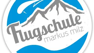 Logo der Flugschule Markus Milz mit Bergsilhouette und Flugzeug in Blau